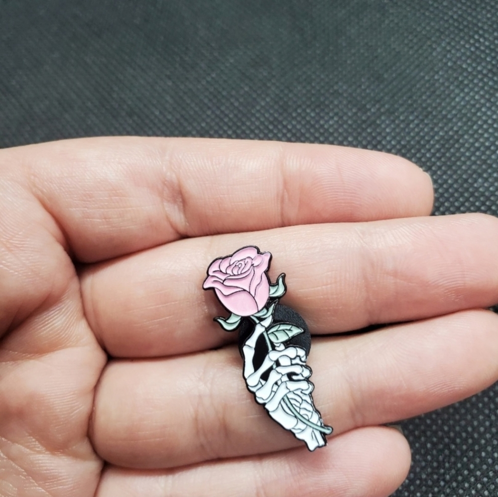 skeleton hand pink rose enamel pin.